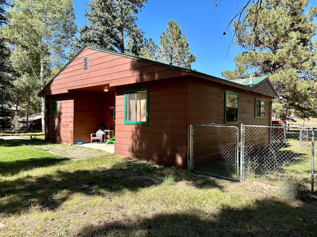 view of property exterior with a yard