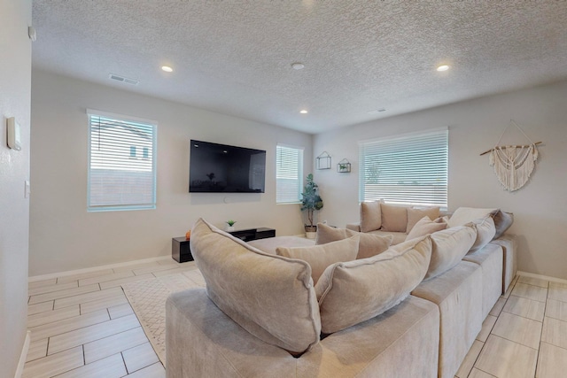 living room with a textured ceiling