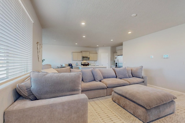 living room featuring a textured ceiling