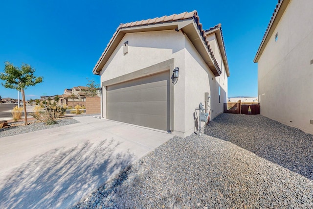 view of side of property featuring a garage