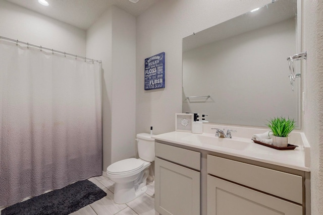 bathroom with vanity, a textured ceiling, tile patterned floors, a shower with curtain, and toilet