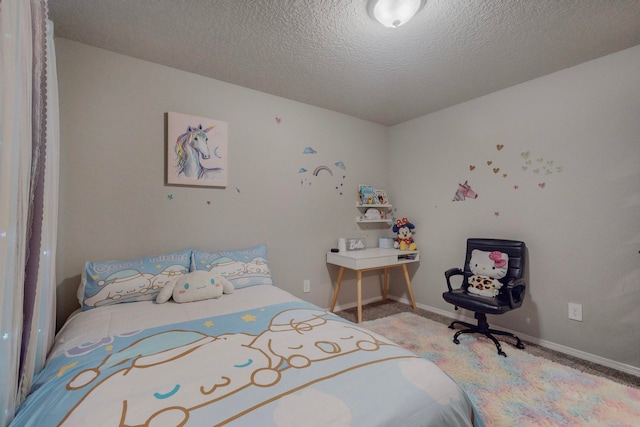 carpeted bedroom featuring a textured ceiling