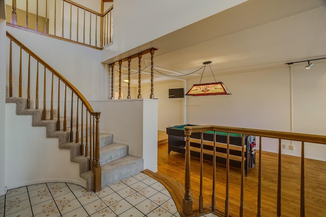 stairway featuring wood-type flooring