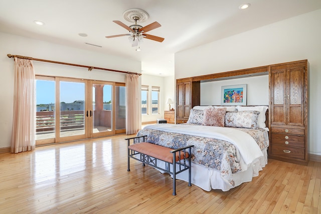 bedroom with french doors, light wood-type flooring, ceiling fan, and access to outside