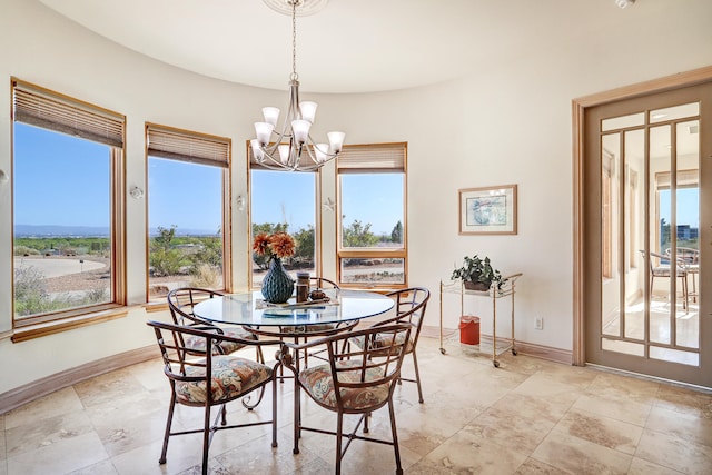 dining room with a chandelier and a healthy amount of sunlight