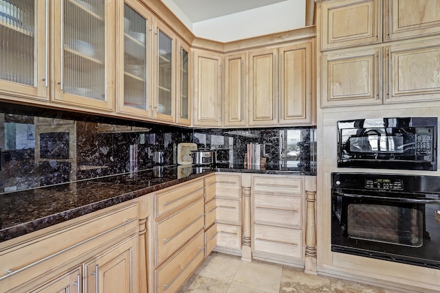 kitchen with tasteful backsplash, light brown cabinets, light tile patterned floors, black appliances, and dark stone counters