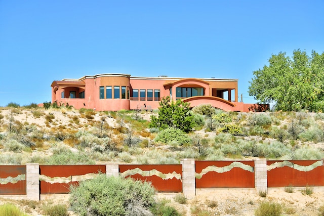 view of front of house with a balcony