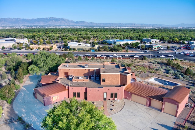 birds eye view of property with a mountain view