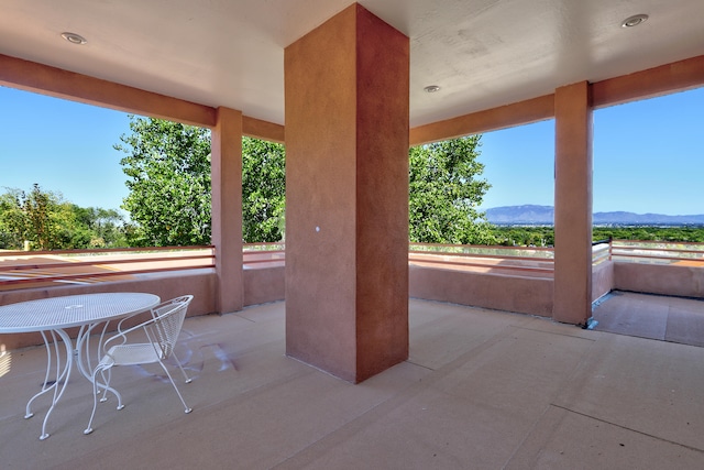 view of patio / terrace with a mountain view