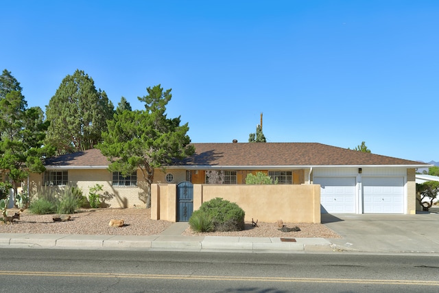 ranch-style house featuring a garage