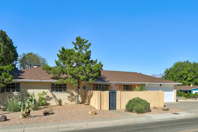 ranch-style home with a garage