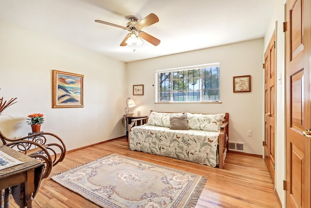 living area featuring ceiling fan and light wood-type flooring