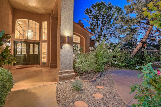 view of exterior entry featuring french doors