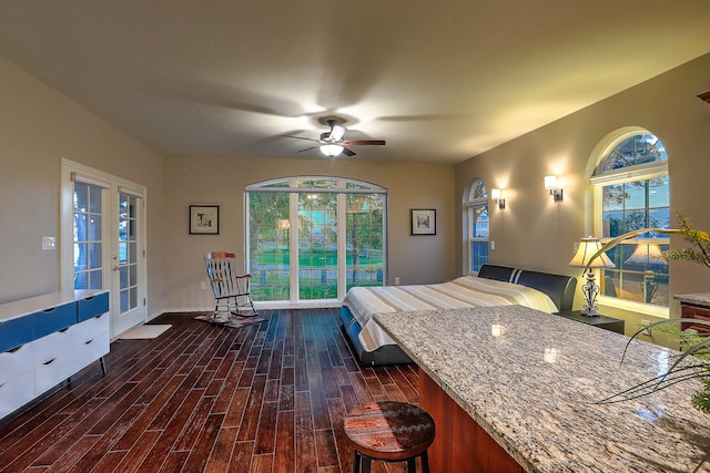 bedroom featuring ceiling fan, french doors, and dark hardwood / wood-style flooring