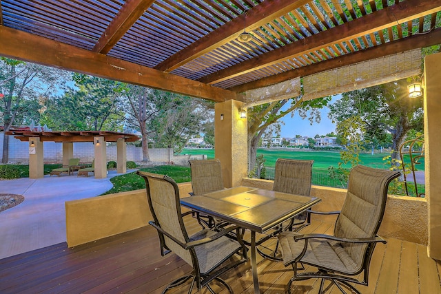 wooden terrace with a patio, a lawn, and a pergola