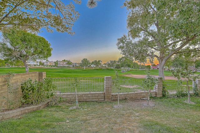 view of yard at dusk