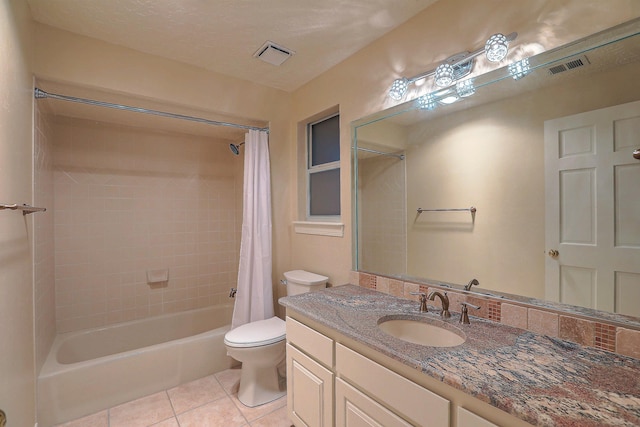 full bathroom featuring tile patterned flooring, toilet, shower / bath combination with curtain, vanity, and a textured ceiling