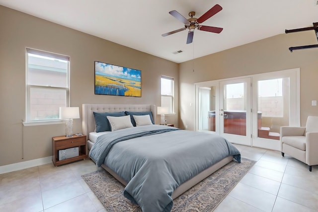 bedroom with ceiling fan and light tile patterned flooring