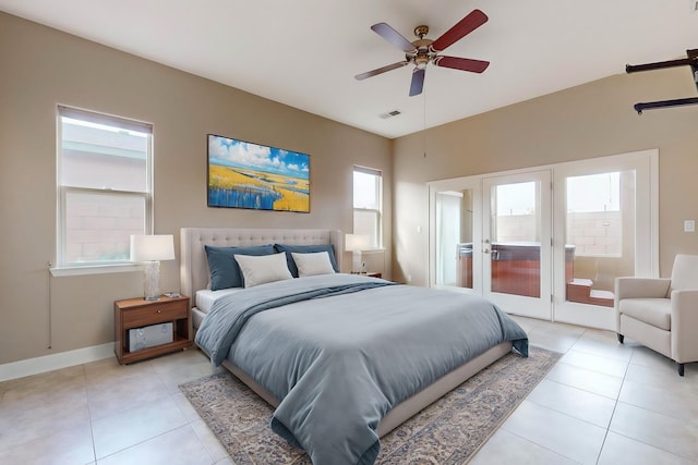 370 Zuni River Cir SW, Los Lunas, NM 87031 - bedroom featuring light tile patterned flooring, access to exterior, a ceiling fan, and french doors