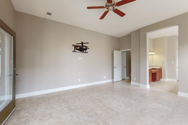 spare room with ceiling fan