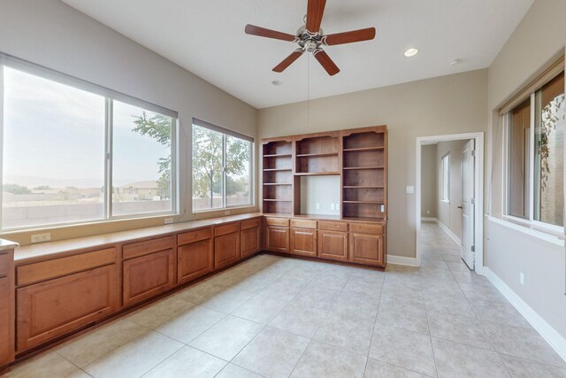 office area with ceiling fan and light tile patterned floors