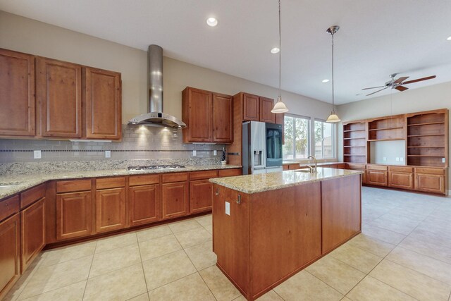 370 Zuni River Cir SW, Los Lunas, NM 87031 - kitchen with wall chimney exhaust hood, stainless steel fridge with ice dispenser, brown cabinets, ceiling fan, and recessed lighting