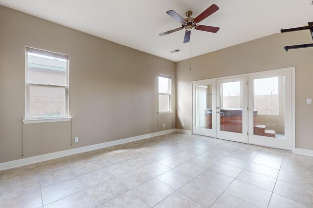 370 Zuni River Cir SW, Los Lunas, NM 87031 - unfurnished room with a ceiling fan, light tile patterned floors, and french doors