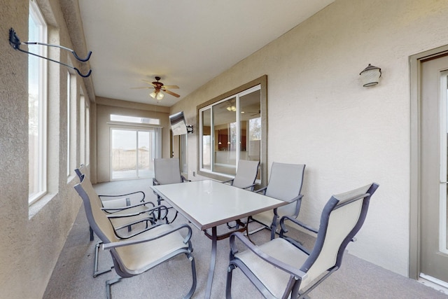 sunroom / solarium featuring ceiling fan