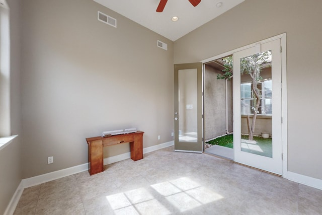 interior space with lofted ceiling and ceiling fan