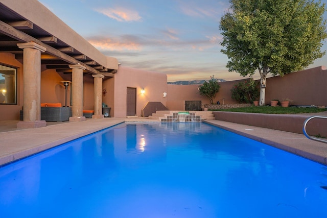 view of pool with a fenced in pool, a patio area, a fenced backyard, and an outdoor hangout area