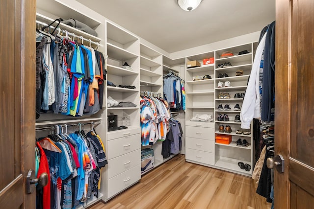 walk in closet featuring light wood finished floors