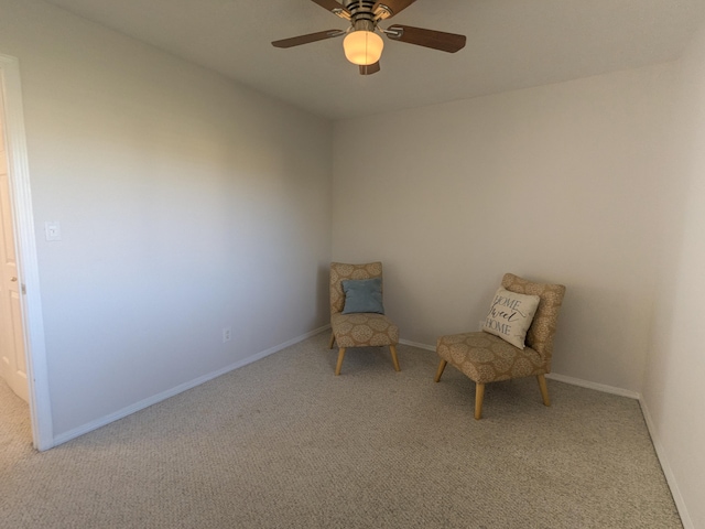 unfurnished room with ceiling fan and light colored carpet