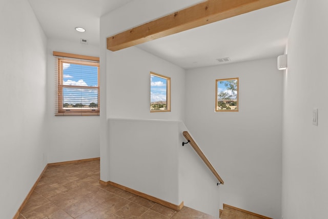 stairway featuring tile patterned flooring