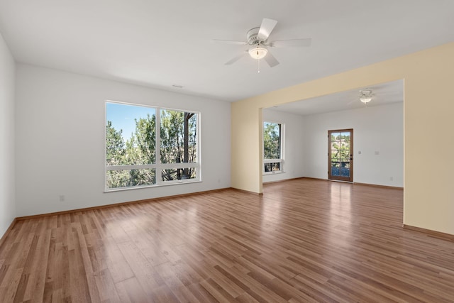 unfurnished room featuring ceiling fan and hardwood / wood-style floors