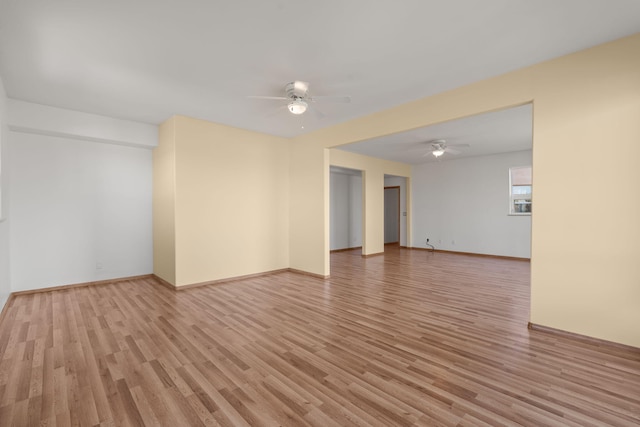 empty room featuring light hardwood / wood-style floors and ceiling fan