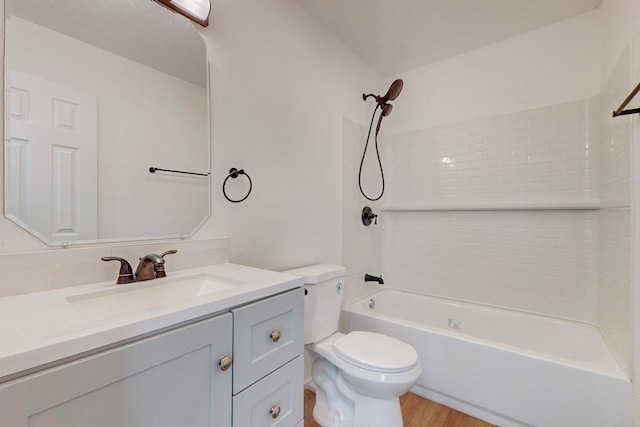 full bathroom featuring shower / tub combination, vanity, toilet, and hardwood / wood-style flooring