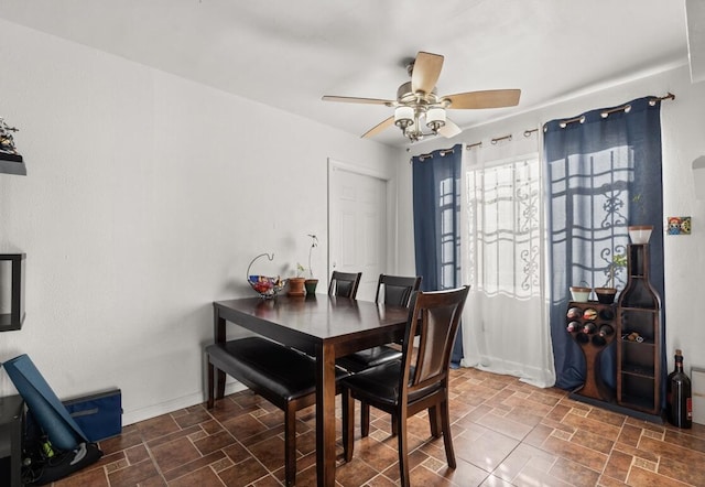 dining room featuring ceiling fan