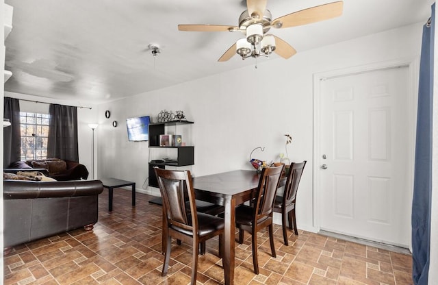 dining space featuring ceiling fan