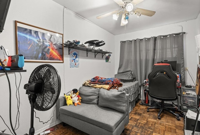 bedroom with ceiling fan and dark parquet floors