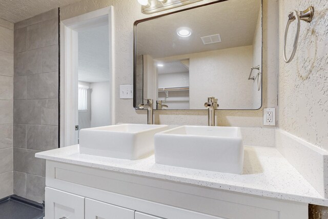 kitchen featuring light tile patterned floors and white cabinets