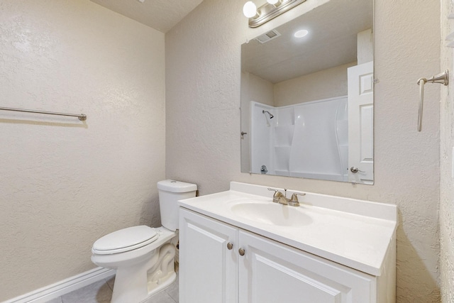 full bathroom featuring a shower, visible vents, a textured wall, toilet, and vanity