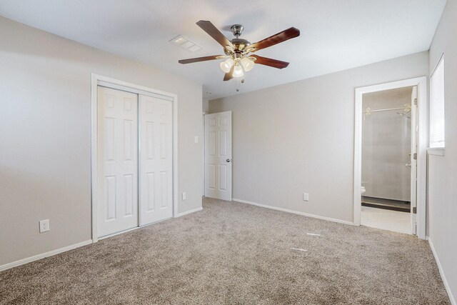 bathroom with vanity, a textured ceiling, toilet, and a shower with door