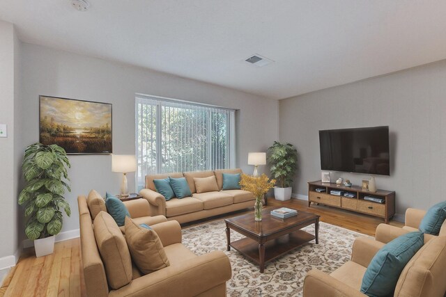 living room with light hardwood / wood-style floors