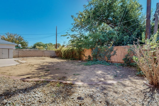 view of yard featuring a fenced backyard