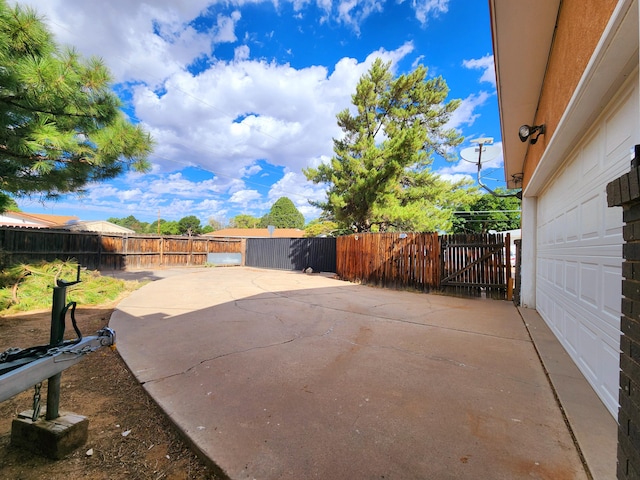 view of patio featuring a garage