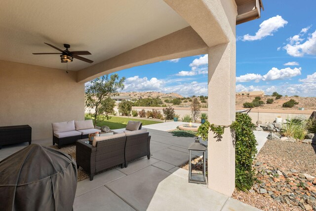 view of patio / terrace with outdoor lounge area, grilling area, a mountain view, and ceiling fan