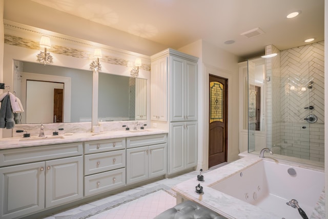 bathroom featuring shower with separate bathtub and vanity