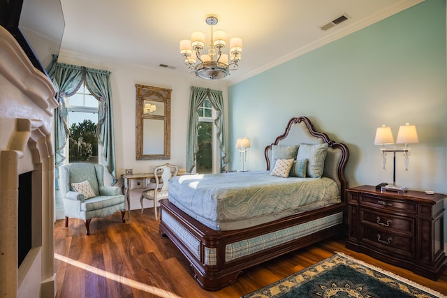 bedroom featuring dark hardwood / wood-style floors, crown molding, and an inviting chandelier