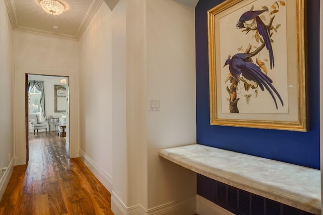 hall with crown molding and dark hardwood / wood-style flooring