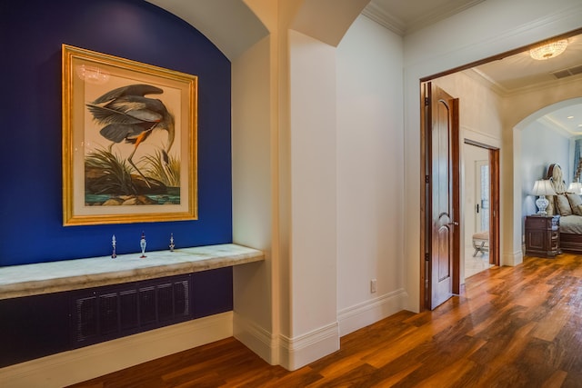 hallway featuring dark hardwood / wood-style flooring and ornamental molding